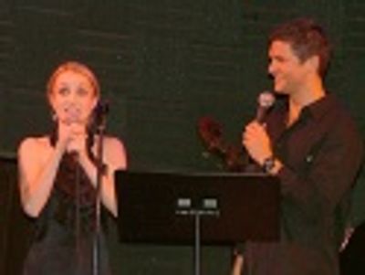 Singing a song written just for them, Kate Reinders and David Burtka Photo