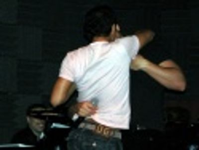 and embrace in a passionate kiss to screams and
deafening applause! Photo