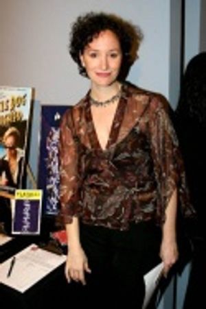 Barbara Walsh with the Company items for silent auction Photo