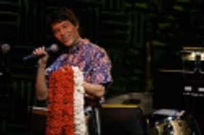 Jason with leis flown in for the night from Honolulu.
Audience leis compliments of J Photo
