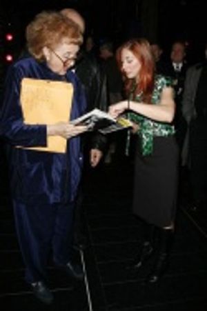 Terry Marone (Actors' Equity) with Lorin Latarro, who offers the robe to cast member  Photo