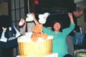 Ann posing with some of her gifts Photo