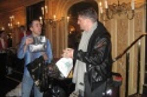 Nathan Taylor presents Christopher Sieber with a "Golden Foot Award" as a farewell Photo