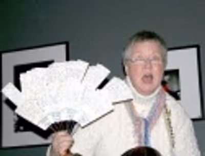 Folk singer Christine Lavin displays her MANY Chaperone tickets, so far she's attende Photo