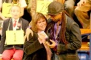 Derrick Baskin with audience speller Photo