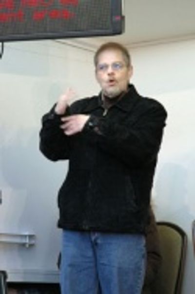 Don Rubel signing for the deaf - another program and service that the Paper Mill prov Photo