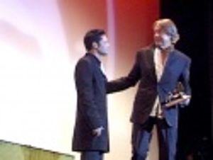 Schumacher thanking Corey Feldman for his award Photo
