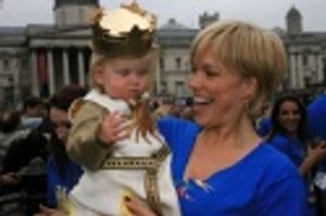 Hannah Waddingham (The Lady of the Lake) holds Evie Peters Photo