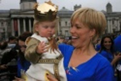Hannah Waddingham (The Lady of the Lake) holds Evie Peters Photo