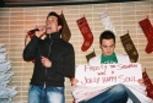 John Tartaglia singing Frosty the Snowman with Scott's assistance holding up cue card Photo