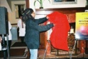 Whoopi unveiling her painting for the crowd Photo