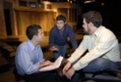 Gamm Artistic Director Tony Estrella (seated, left), playwright Paul Grellong (center Photo