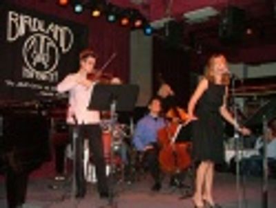 Amanda starts things off with a bang backed by the
Tom Kitt Band Photo