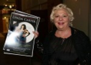Renee Taylor arrives with poster in hand Photo