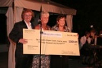 Marti Heinbaugh of Mission Valley Bank presents check to Mark Salyer and Andrea Slomi Photo
