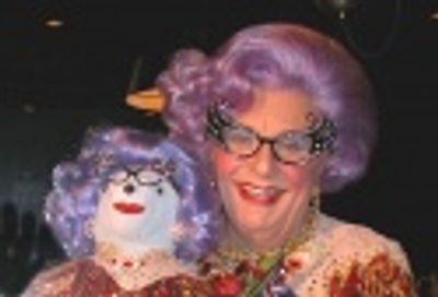 Dame Edna poses with her bear...

 Photo