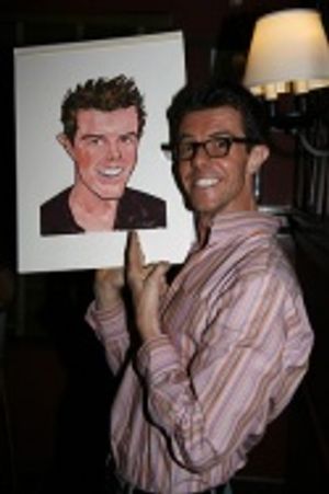 Gavin Lee signs his caricature Photo