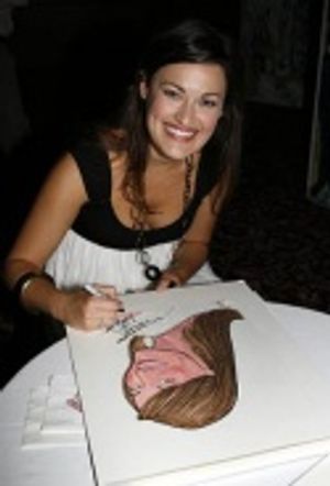 Ashley Brown signs her caricature Photo