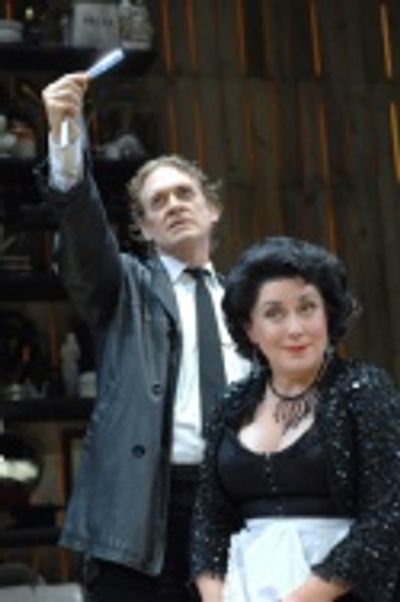 
Sweeney Todd (David Hess) and Mrs. Lovett (Judy Kaye) conspire to "shave the faces  Photo