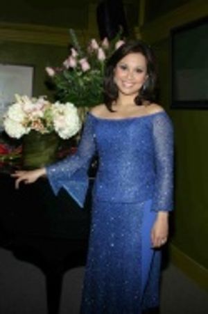 Dressing Room - Lea graciously poses for pictures before performing. Photo