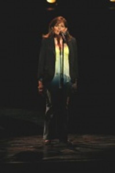 Michelle Nicastro sings about The Happiest Place on Earth in Disneyland  Photo