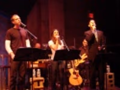 Adam Pascal, Lea Michele and Greg Naughton in the opening number, "Sing."
 Photo