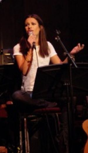 A shoeless Lea Michele portrayed a high school senior who seeks solace from the trage Photo