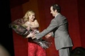 
Denis Presenting Christina with Flowers Photo