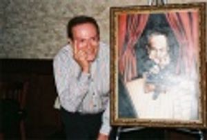 Jerry Herman posing with his painting for Tony DiNapoli's Broadway Wall of Fame, whic Photo