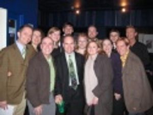 Composer Stephen Flaherty (center) surrounded by cast members and director Scott Ferg Photo