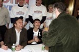 Harvey takes a picture of Sarah Gettelfinger and Gregory Jbara Photo