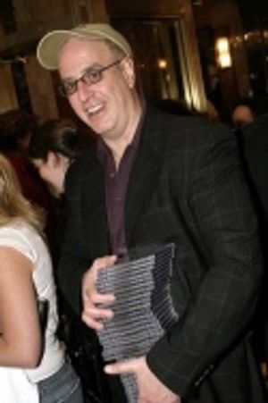 Book Writer Jeffrey Lane with a stack of free CDs Photo