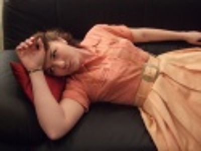 Katie Klaus has a bit of a fainting spell on my fainting couch. Photo