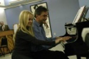 Kristin Chenoweth joins Music Director Rob Fisher at the piano, during rehearsals for Photo