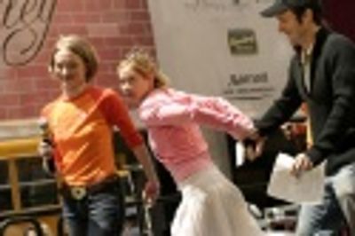 Christina clearing the stage for Joyce Chittick and Anika Ellis to perform "Baby, Dre Photo