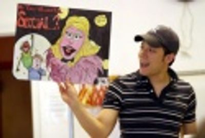 John holding up a poster a student made for him Photo
