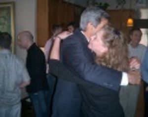 John Kerry embracing Kathleen Turner Photo