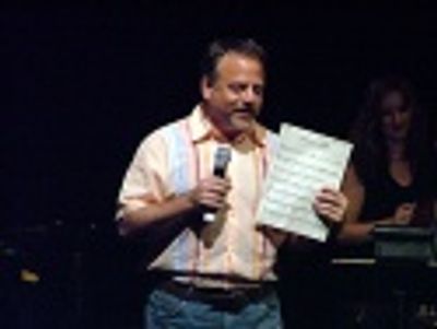 Marc Shaiman humorously hijacked the evening with
his revised lyrics to "Welcome to  Photo