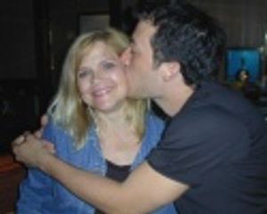 Newsical Director and Original Chorus Line Donna Drake gets a smooch from John Tartag Photo