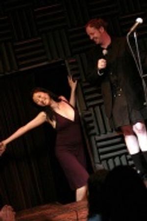 Spelling Bee's Deborah S. Craig distracts Emcee Jamie McGonnigal Photo