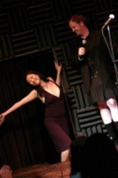 Spelling Bee's Deborah S. Craig distracts Emcee Jamie McGonnigal Photo