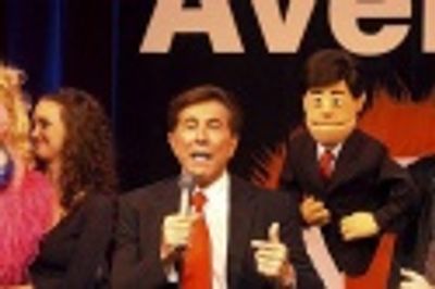 Steve Wynn poses with his puppet

 Photo