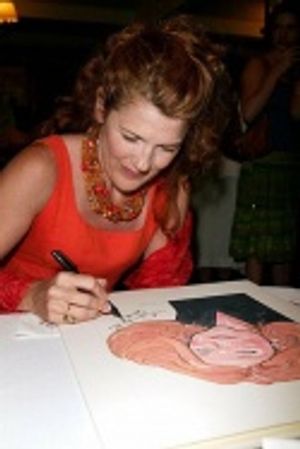 Signing her painting for the wall...  Photo