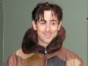 Alan Cumming stops for a smile  Photo