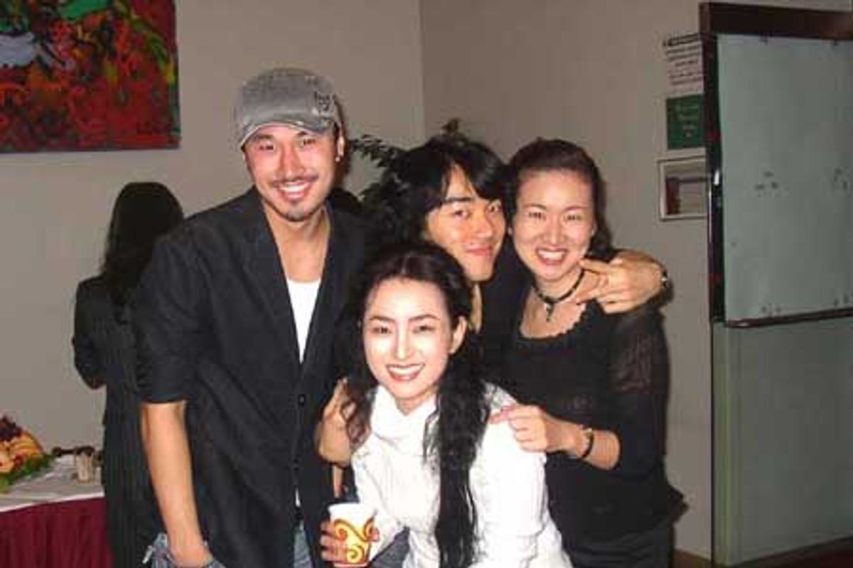 Hyo Sung Kang (center) celebrates with fellow cast mates  at 