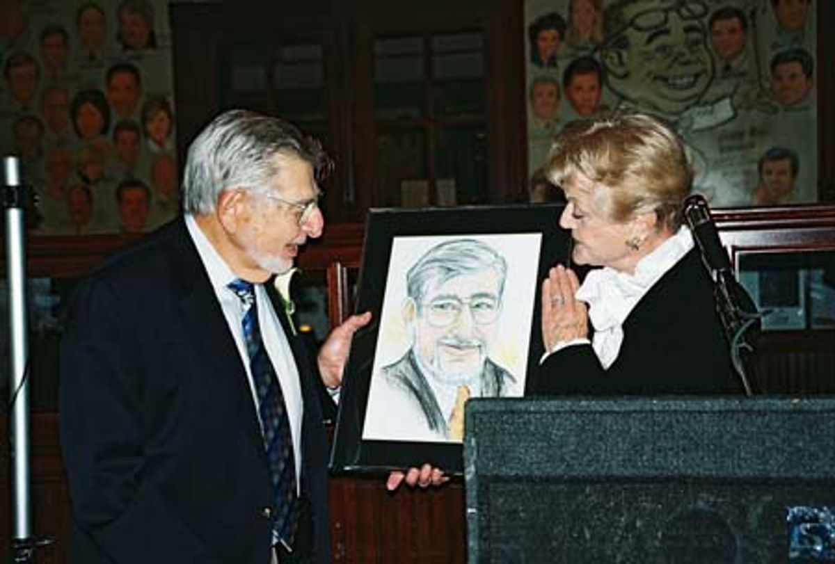 Angela Lansbury presenting Biff Liff with a copy of his caricature which will appear on the walls of the Palm Restaurant for all his years of service to the theatrical community at 
