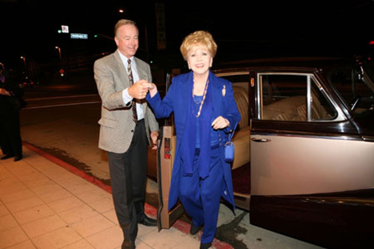 MGM star Debbie Reynolds arrives on red carpet in classic 1940 car at 