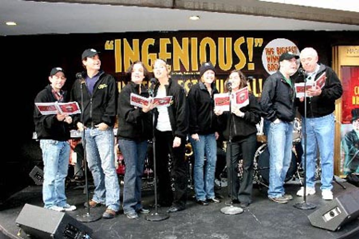 Drowsy Chaperone cast members treat Times Square  to a holiday carol outside the Marriot Marquis Theatre at 