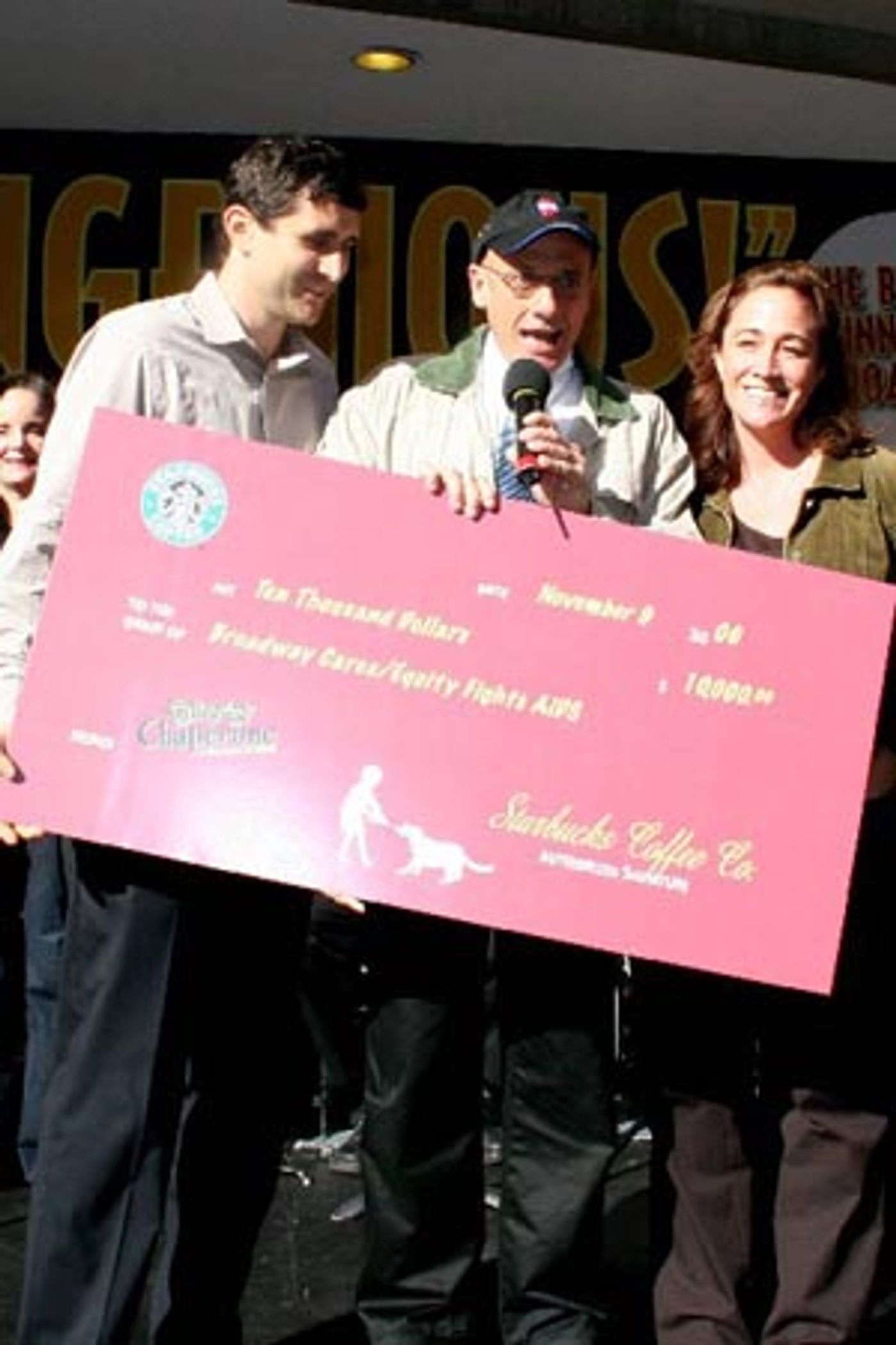 Tom Viola of BC/EFA, flanked by Dan Lewis (Starbucks New York Metro Marketing Manager) and Suzanne DeChant (Starbucks Northeast Marketing Director) receives a check for $10,000 from Starbucks