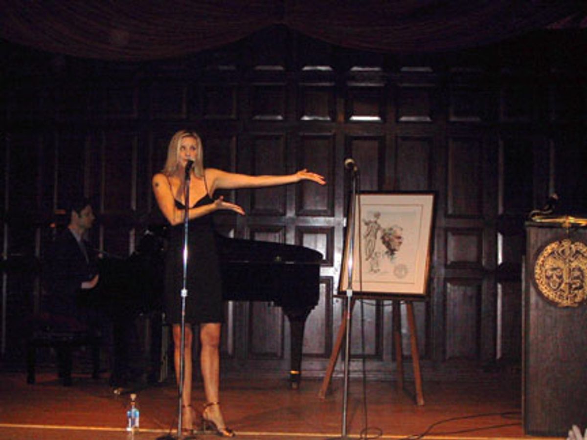 Jenn Colella works the crowd during her performance; background: Tom Kitt at 